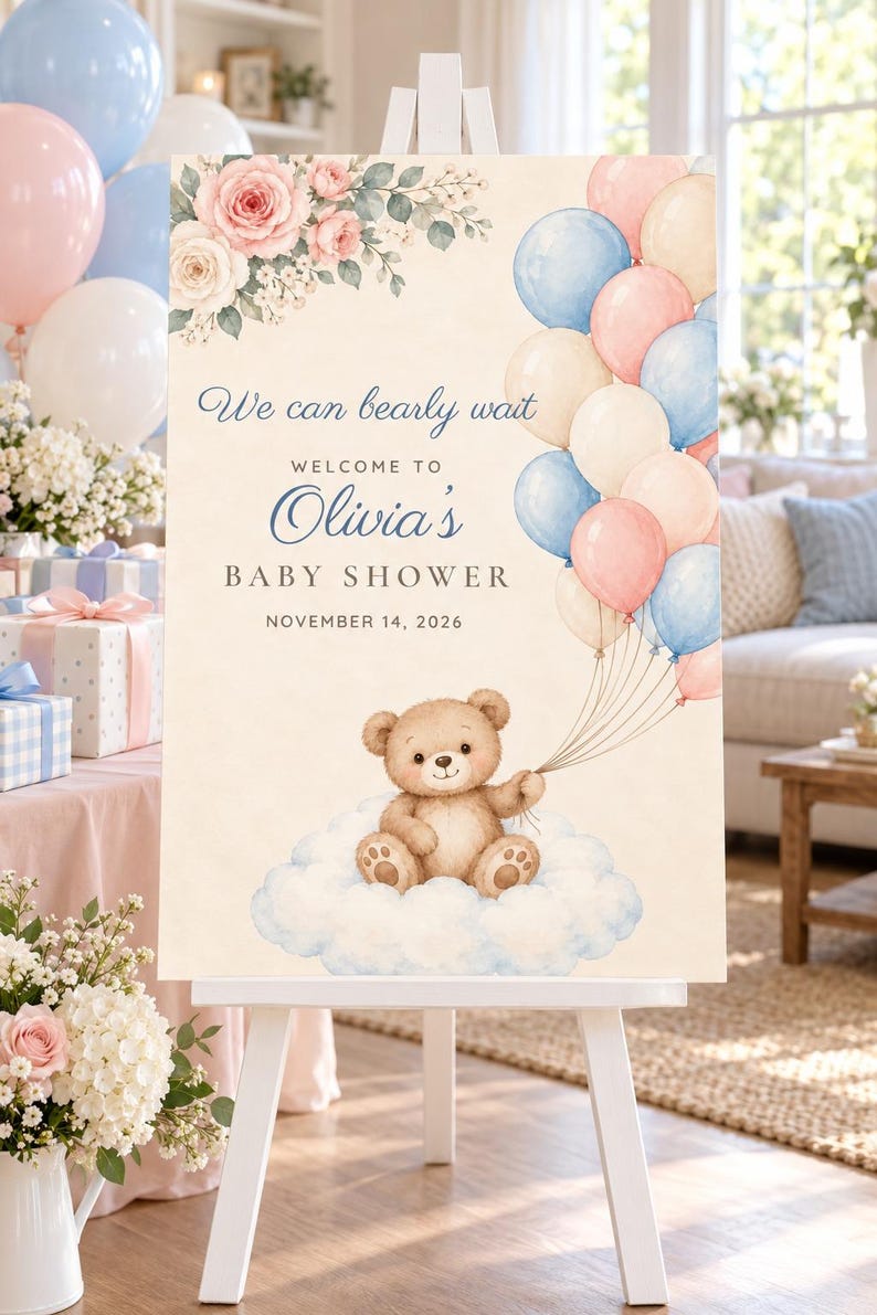 May include: A rectangular baby shower welcome sign on a white easel featuring a watercolor illustration of a brown teddy bear sitting on a cloud, holding a bunch of pink, blue, and cream balloons. Text reads: We can bearly wait, WELCOME TO Olivia's BABY SHOWER, NOVEMBER 14, 2026, with pink and white floral accents.