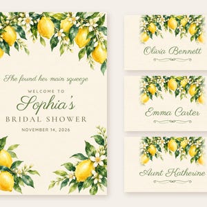 May include: A cream-colored bridal shower welcome sign and three place cards featuring watercolor illustrations of yellow lemons, green leaves, and white blossoms. The text reads: She found her main squeeze, WELCOME TO Sophia's BRIDAL SHOWER, NOVEMBER 14, 2026, Olivia Bennett, Emma Carter, and Aunt Katherine.