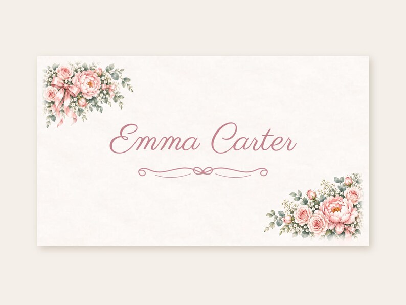 May include: A rectangular card featuring the name Emma Carter in a pink cursive script. The design includes floral arrangements of pink roses and green leaves in the top-left and bottom-right corners, with a decorative pink flourish below the name.