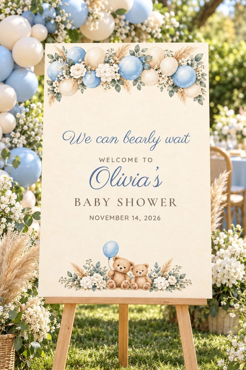 May include: A rectangular baby shower welcome sign featuring a cream background, blue and beige balloon illustrations, floral accents, and two teddy bears. The text reads: We can bearly wait, WELCOME TO Olivia's BABY SHOWER, NOVEMBER 14, 2026.