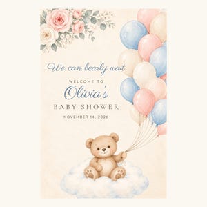 May include: A baby shower invitation card featuring a watercolor teddy bear sitting on a cloud, holding a bunch of pastel balloons. The text reads: We can bearly wait, WELCOME TO Olivia's BABY SHOWER, NOVEMBER 14, 2026, with floral accents.