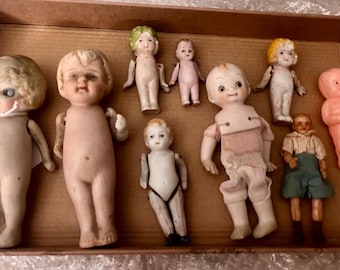 Vintage “as found” porcelain style dolls.  Good found condition.