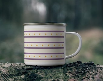 May include: A white enamel mug featuring a repeating pattern of horizontal purple stripes and rows of small yellow stars. The mug has a silver-toned rim and a curved handle on the right side, presenting a clean and symmetrical design.