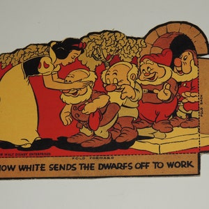May include: Snow White, dressed in a yellow dress and red bodice, is saying goodbye to seven dwarfs. The dwarfs are wearing brown pants, red shirts, and yellow hats. The dwarfs are standing on a platform with a stone archway behind them. The image is from a vintage children's book.