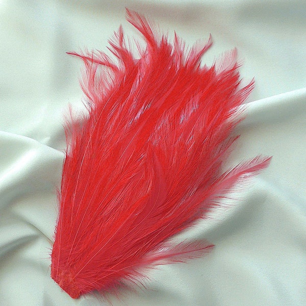 Feather plume, red with a tinge of pink, vintage.  A super plume, just the thing to va-va-voom a hat. c early to mid. 1950's.