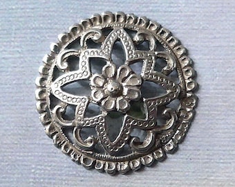 Silver button, pierced, antique.  Possibly an ethnnic button, convex/central flower/decorative rim/tests as silver, metal loop  c 19th. cent
