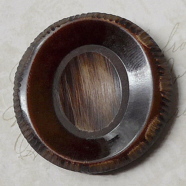 Bakelite button, antique/vintage.  Round, brown with a hand crafted surface to resemble wood, metal loop shank. c1910's-20's.