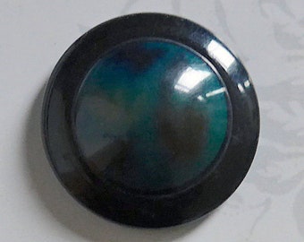 Celluloid button, vintage.  Intermixed coloured centre, painted black border, japanned rev. metal loop shank. c1920's-30's.