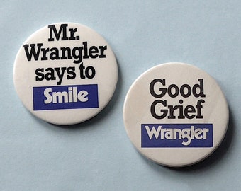 2 badges Wrangler différents, vintage. Insignes ronds - Good Grief Wrangler et M. Wrangler dit de sourire. Années 1970.