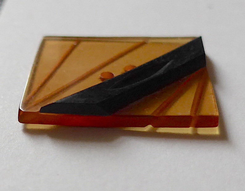 Square with cut diagonal lines with a black bakelite diag vintage 2 hole sew-thru Lucite button top bar apple juice Art Deco c1930/'s