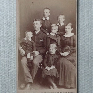Carte-de-visite, sepia, antique.  Featuring a family of 5 children.  Photographer, A & G. Taylor, 1 Baldwin Street, Bristol. 1898-1907.