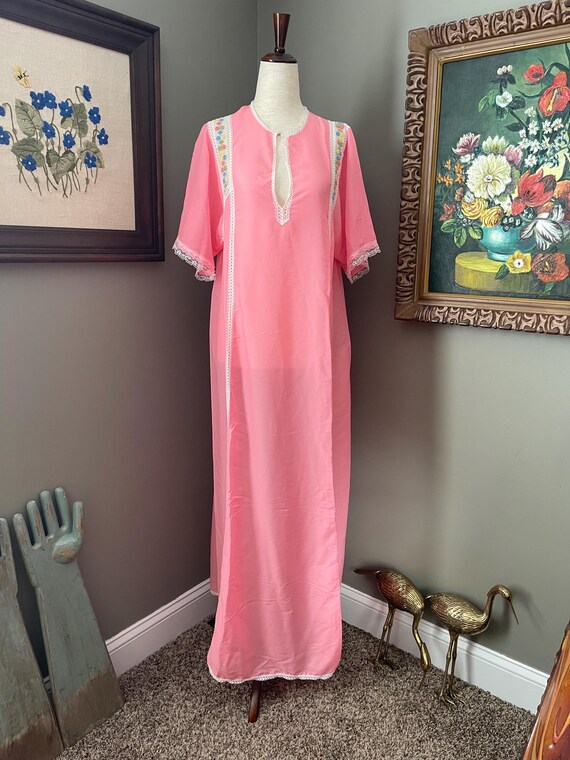 pink lace night dress Satin Cut Out Detail modern edge to the classic slip silhouette Delicate lace trim framing the deep V Pretty Pink Nightgown With Lace