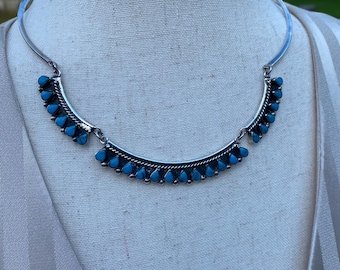 Sterling Silver Turquoise squash-blossom style necklace with strong clasp. Marked Mexico 925. Feminine almost, sweetheart neckline shape.