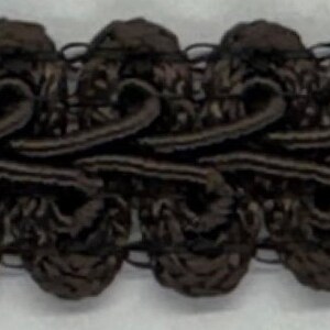 May include: Black braided trim with a decorative, looped design. The trim is approximately 1 inch wide.