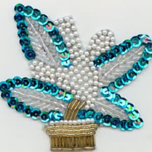 May include: A blue and white beaded flower applique with a gold base. The flower is made of sequins and pearls.