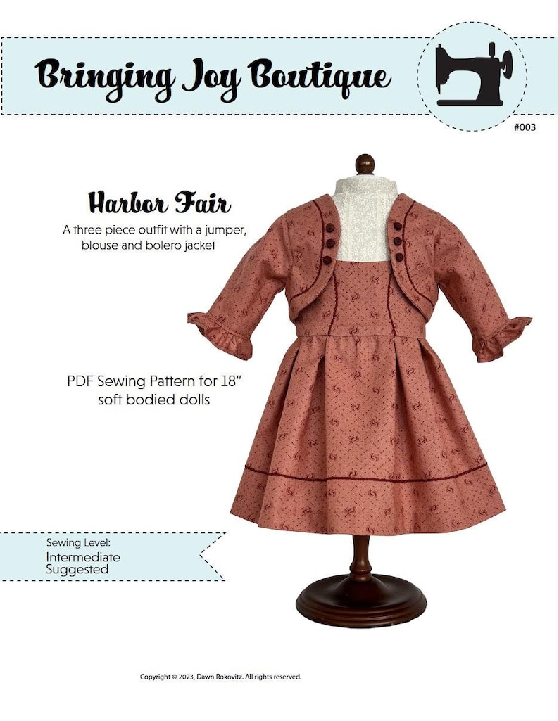 May include: A three-piece doll outfit sewing pattern for 18-inch soft-bodied dolls. The outfit includes a jumper, blouse, and bolero jacket. The pattern is for an intermediate sewing level. The image shows a doll wearing the completed outfit in a pink and white floral print.