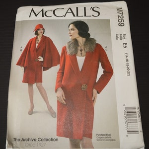 May include: Vintage sewing pattern for a red coat with a fur collar and a matching red cape. The pattern is from McCall's and is for size E5 (14-16-18-20-22). The pattern is from The Archive Collection and is circa 1927.