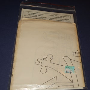May include: A black and white line drawing of a giraffe with a price tag that says "D3. $8.00". The text "The Lord said to Noah: Go and build a boat. 'Cause I'm gonna flood the earth And you're gonna wanna float." is at the top of the image. The text "Scraps of Time now has a vest Of Noah and his Crew. We had a great time making it And we're sure that you will too." is at the top right of the image.