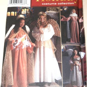 May include: Simplicity Holiday costume collection pattern featuring angel costumes. The cover shows three women in angel costumes with wings and halos. The costumes are in shades of white, gold, and peach.