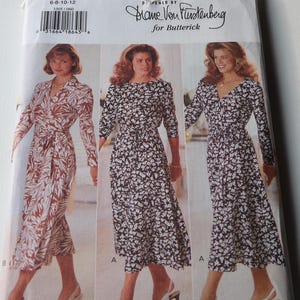 May include: A sewing pattern for a dress designed by Diane Von Furstenberg for Butterick. The pattern is for sizes 6-8-10-12 and features three different styles of dresses. The dresses are all knee-length and have a wrap-style bodice. The pattern is printed on a white background with black text.