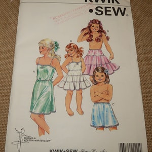May include: A sewing pattern for girls' underwear, featuring four different styles. The pattern is called "Kwik-Sew" and is for sizes 4-5-6-7. The pattern is designed by Kerstin Martensson.
