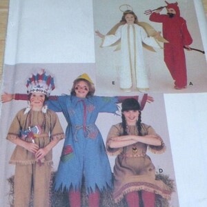 May include: Butterick 4073 sewing pattern envelope featuring illustrations of five costume designs: a white angel with gold wings, a red devil with a pitchfork, a tan fringed outfit with a feathered headdress, a blue scarecrow, and a tan dress.