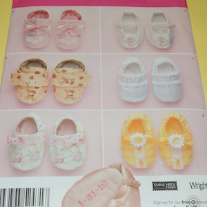May include: A sewing pattern for baby booties with different designs. The designs include a deer, a flower, a heart, and a simple design. The pattern is from Wright's and Laine Heigl Designs.