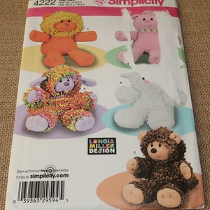May include: A sewing pattern for making four stuffed animals: a lion, a pig, a lamb, and a bear. The pattern is from Simplicity and is designed by Longia Miller Design. The pattern is for one size.