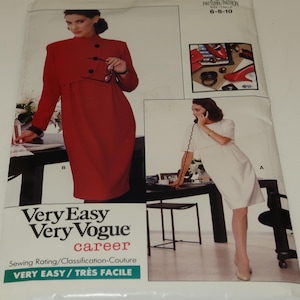 May include: A sewing pattern for a dress with two different styles. The first style is a red dress with a collar and buttons. The second style is a white dress with a round neckline. The pattern is labeled "Very Easy Very Vogue career" and "VERY EASY/TRÈS FACILE".