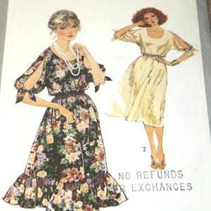May include: Simplicity 8586 sewing pattern featuring two dress designs. One dress has a floral print with a ruffled hem and cut-out sleeves. The other dress is a solid color with cut-out sleeves and a gathered waist. The pattern includes the text "NO REFUNDS OR EXCHANGES."