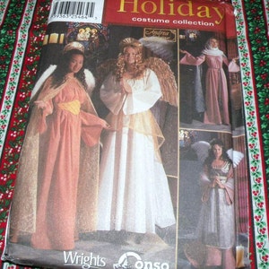 May include: A sewing pattern for a holiday costume collection featuring angel costumes. The cover displays images of women in various angel-themed outfits, including flowing gowns, wings, and halos. The pattern is from Andrea Schewe and Wrights/Conso.