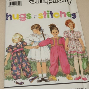 May include: Simplicity pattern 7033, hugs+stitches, for sizes 2-6X. The pattern includes four different outfits for girls: a floral jumpsuit, a white dress with lace trim, a pink jumpsuit with embroidery, and a floral dress with puffed sleeves.