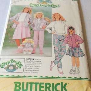 May include: A vintage sewing pattern for making children's clothing. The pattern includes instructions for making a pink skirt, a floral print pants, a pink jacket, and a white sweatshirt. The pattern is from the brand Butterick and includes iron-on transfers.
