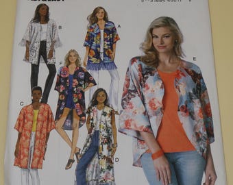May include: A Butterick sewing pattern, B6176, featuring various kimono-style jackets. The pattern cover displays multiple women modeling the jackets in different floral and patterned fabrics. The text "FAST & EASY" is visible.