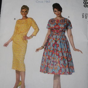 May include: Vintage McCall's sewing pattern for two dresses, one with a floral print and the other with a yellow and white pattern. The pattern is from the Archive Collection and is circa 1963. The pattern number is M7086.