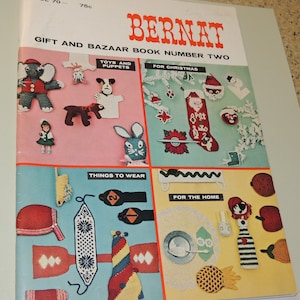 May include: A vintage Bernat Gift and Bazaar Book Number Two. The cover features crochet patterns for toys, puppets, Christmas decorations, items to wear, and home decor. The cover is divided into four sections with various colorful crochet projects.