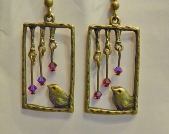 Bird motif of Antique Brass Metal/ Swarovski Crystals Siam AB color on Ear wires