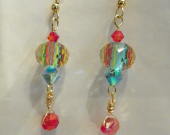 Turquoise center, striations of yellow/orange beads/ Swarovski crystals earrings