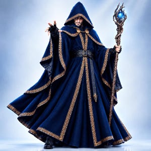 May include: A dark blue hooded cloak with gold-colored trim and a black belt, worn over a matching robe. The figure holds a tall, twisted brown staff topped with a glowing blue orb, while wearing black gloves and dark footwear.