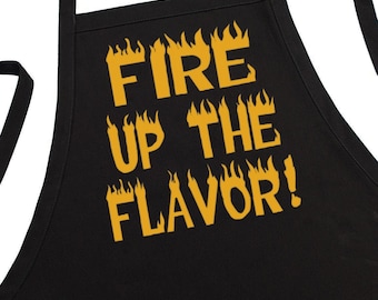 CoolAprons Black BBQ Apron Fire Up The Flavor, Two Pockets, Fully Adjustable, Extra Long Ties, One Size Fits All