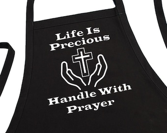 Spiritual Kitchen Apron Life Is Precious Handle With Prayer, Black Chef Apron With Two Front Pockets And An Adjustable Neck Strap