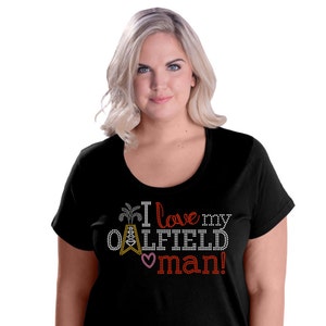 May include: Black t-shirt with a rhinestone design that says "I love my oilfield man!" with a small pink heart.