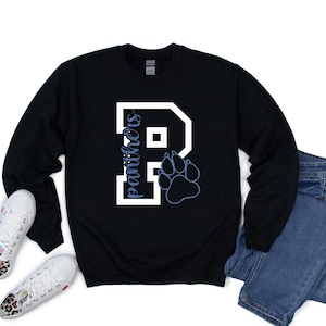 May include: Black sweatshirt with a white letter "P" and the word "Panthers" inside the letter. A blue paw print is to the right of the letter.