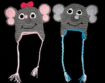 May include: Two crocheted elephant hats with long ties. One hat is gray with pink ears and a pink bow, the other is gray with blue ties.