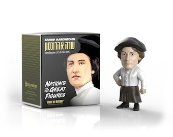 May include: A black and white box with the text "Sarah Aaronson" and "Nation's Great Figures" on it. The box contains a 8 cm figurine of Sarah Aaronson, a woman wearing a black beret and a white shirt. The figurine is standing on a white surface.