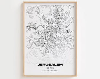 May include: A black and white line art map print of Jerusalem, Israel. The print is framed in a light wood frame and has the text "JERUSALEM - ISRAEL - 31.7683°N / 35.2137°E" at the bottom.