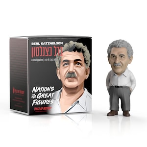 May include: A figurine of Berl Katznelson, a historical figure, stands next to its box. The figurine is 8 cm tall and depicts a man with gray hair, a mustache, and a white shirt. The box features a portrait of Katznelson and the text "NATION'S GREAT FIGURES."