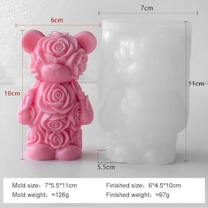 May include: A pink, rose-covered bear-shaped mold and a clear, bear-shaped mold. The pink mold is 10 cm tall and 6 cm wide. The clear mold is 7 cm wide and 11 cm tall. The mold sizes are 7 x 5.5 x 11 cm.