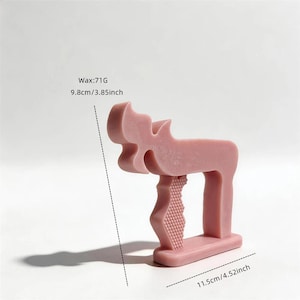 May include: A dusty pink wax figure shaped like a stylized moose, measuring 9.8 cm or 3.85 inches in height and 11.5 cm or 4.52 inches in length. The wax weighs 71G and features a textured honeycomb pattern on the front leg and a smooth finish.