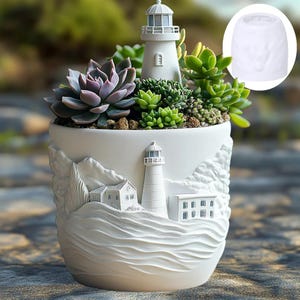 May include: White ceramic planter with a lighthouse design, filled with succulents. The planter features a detailed relief of a lighthouse, buildings, and waves. The succulents include a variety of green and purple plants.